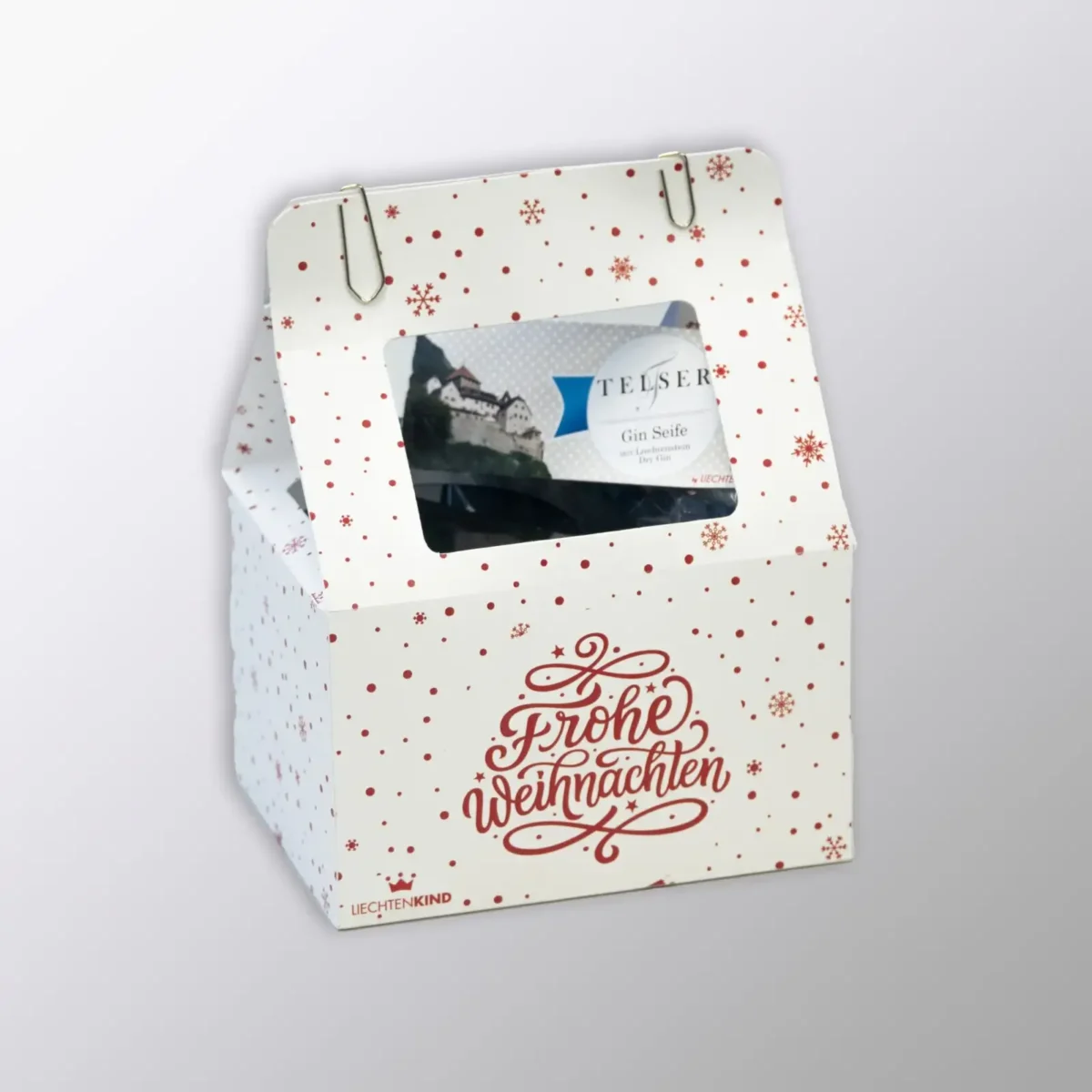 Gift box from Liechtenkind with various items, elegantly presented in a Christmas packaging.